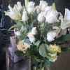 All white flower arrangement in base