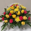 Yellow roses, fuji mums are carnations with a background of greenery make