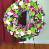 Mini green hydrangeas, leather leaf, spray roses, pomms and hot pink carnations
