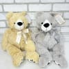 A big fluffy grey or tan teddy bear. 
