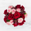 This arrangement includes purple cymbidium orchids, red roses, &amp; pink roses. Truly