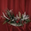 A Christmas ornamental arrangement typically features festive elements designed to evoke the
