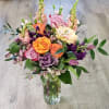 A spring mix pastel blooms w some roses. Picture is a premium