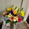A beautiful mix of in season blooms.  This arrangement is about