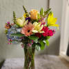 A beautiful mix of in season blooms.  This arrangement is about