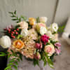 A beautiful spring mix in with hydrangeas, roses, tulips, and ranunculus if