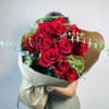 Celebrate the holidays with a relaxed, hand-tied bouquet featuring stunning Freedom roses