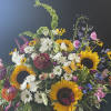 A basket filled with seasonal flowers.  These photos are an example