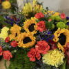 A sunny sunflower bouquet gets a spin with the addition of pretty