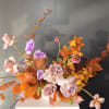 A gorgeous long and low arrangement made to brighten up any room.