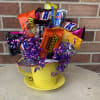 This cute candy bouquet comes in a colored tea cup and is