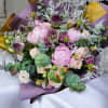 Delight in the timeless elegance of this pastel bouquet, featuring luscious pink