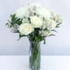 The Cherished Friend Bouquet is designed with bright white roses and Peruvian