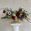 This beautiful Christmas arrangement is sure to delight and bring in the