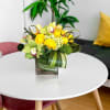 Green or yellow cymbidium orchids, green hydrangea, and dianthus detailed  here