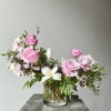Designed in our signature style: a lush garden-style mix of seasonal blooms