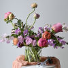 Designed in our signature style: a lush garden-style mix of seasonal blooms