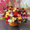 Brighten your autumn celebrations with our Limited Edition Fall Pumpkin Floral Arrangement!
