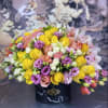 Brighten any space with our Elegant Flower Box Arrangement! Bursting with vibrant