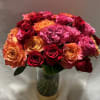 This large bouquet of three dozen, long-stemmed roses in orange, hot pink
