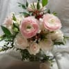 If you love blush colored flowers, this hand-tied bridal bouquet and bout