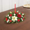 Our traditional table arrangement creates the perfect centerpiece for your Christmas celebration.