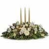 a beautiful white centerpiece designed with white roses, white alstroemeria, white spray