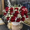 Brighten any space with our Elegant Holiday Flower Arrangement! Bursting with vibrant