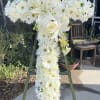 This lovely floral cross is a beautiful addition to the memorial service