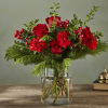 Seductive and serious, this deep crimson bouquet of roses, carnations, boxwood and