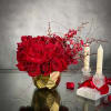 A lovely Gold Geometric vase holds this luscious arrangement of about 50