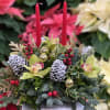 This elegant decorative centerpiece features a luxurious blend of natural and festive