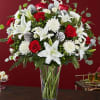 Lilies mums roses carnations pine, pine cones fresh xmas greens