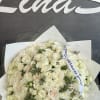 A white roses bouquet is a classic and elegant arrangement that symbolizes