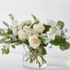 A designers choice centerpiece using seasonal white blooms will be created. (Some