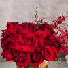 A lovely Gold Geometric vase holds this luscious arrangement of about 50