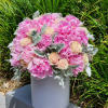 Indulge in the charm of our pink peonies, nestled within exquisite hatboxes