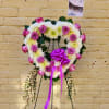 Heart shape standing easel with chrysanthemums and roses.
