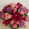 Roses mixed with little roses in a 5 x 5 cylinder wrapped