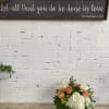 Cute arrangement in white container with roses and other blooms
