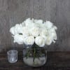 This  signature arrangement of 24 white roses will create a stunning