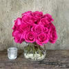 Lovely hot pink roses in a modern cylinder 
