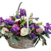 Elevate your gifting experience with our exquisite purple posies basket arrangement, bursting