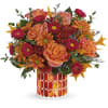 Artfully arranged in a beautiful keepsake vase of stained glass mosaic, this