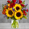 A sunny sunflower arrangement gets an autumnal spin with the addition of