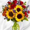A sunny sunflower arrangement gets an autumnal spin with the addition of
