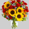 A sunny sunflower arrangement gets an autumnal spin with the addition of