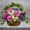 Lush flowers to celebrate a full life. This beautiful basket of flowers