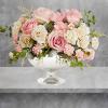 Illuminate love with embracing soft pastel shimmer and cradling an exquisite arrangement