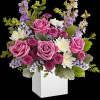 A playful spin on the classic rose arrangement, these lovely lavender blooms
